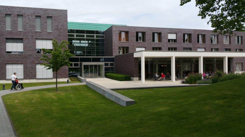 a rehabilitation center with a green lawn